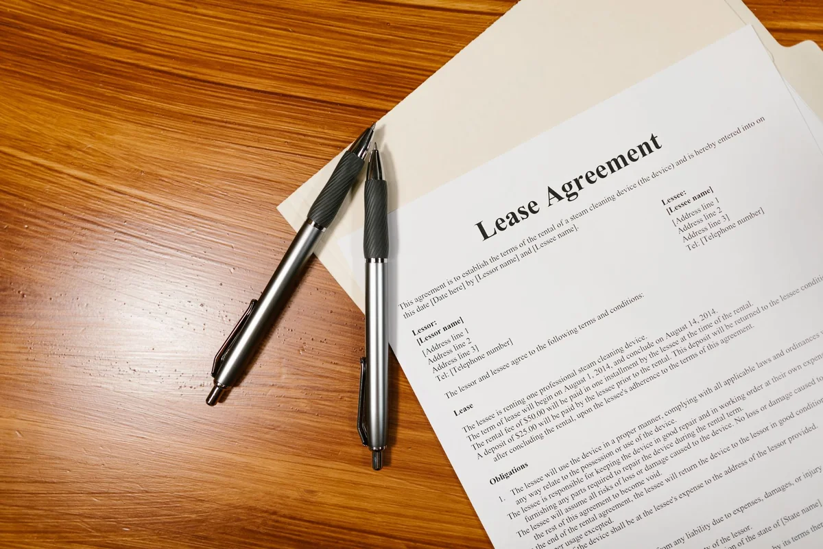 Closing paperwork and a pen, the title work that sets how fast you can close on a cash home sale in Iowa
