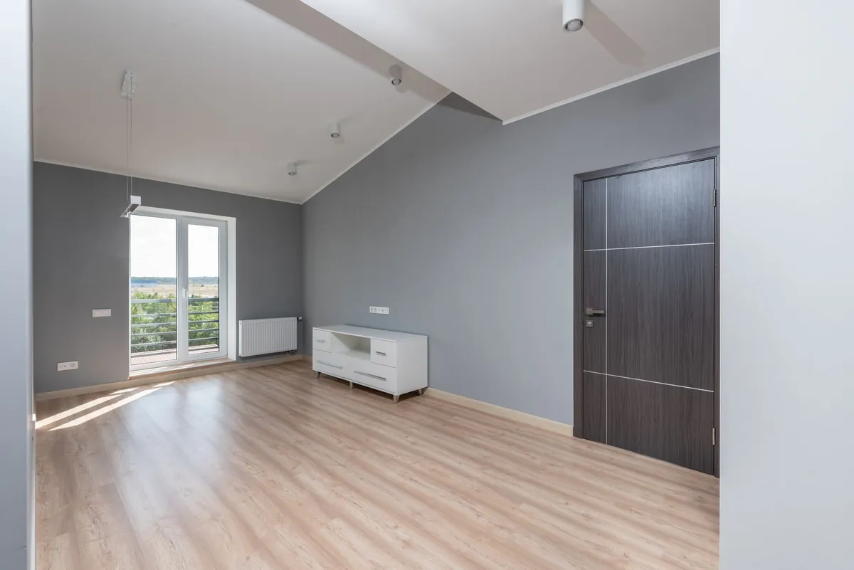 An empty room in a house, the risk a seller inherits if a contract-for-deed buyer walks away