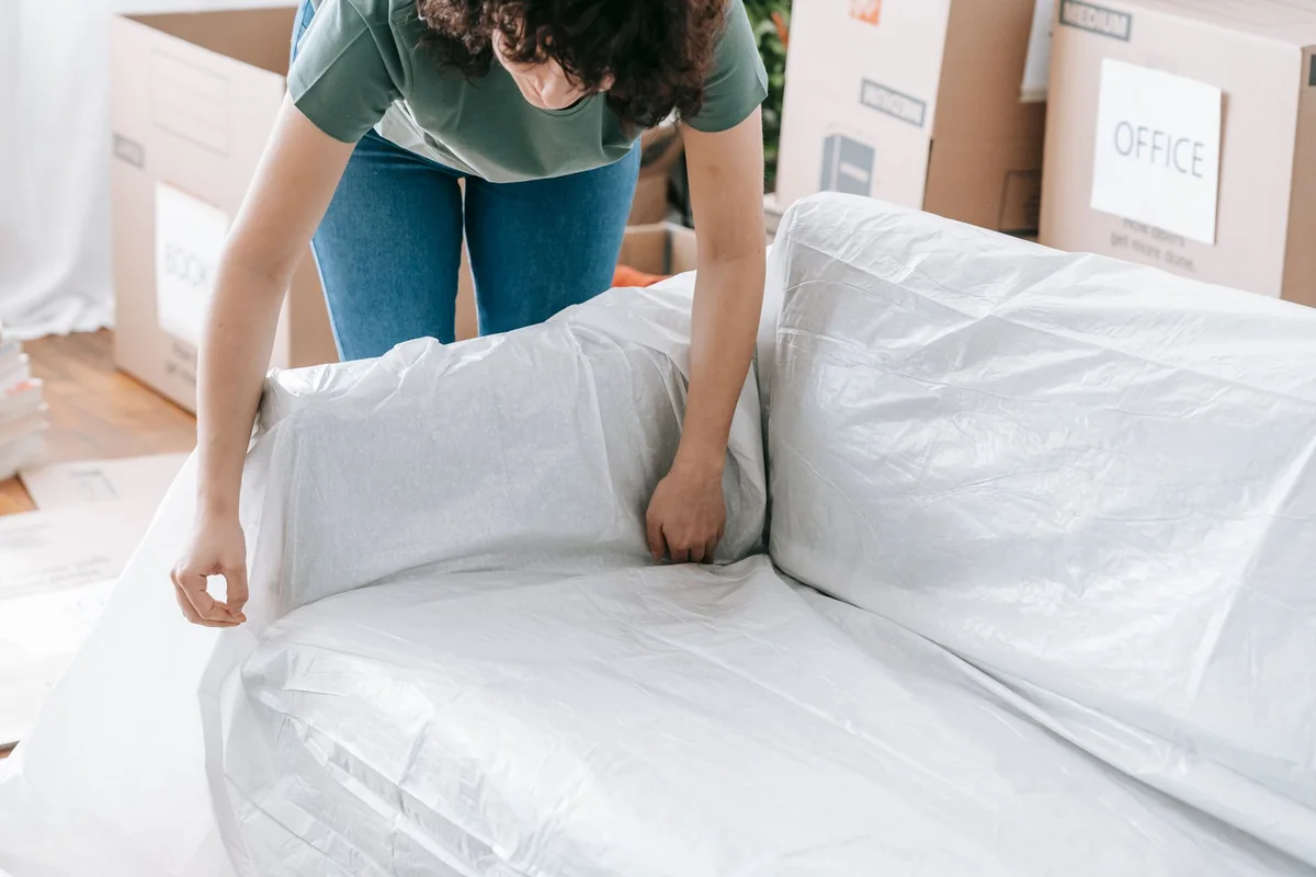 Packing up a living room as part of a step-by-step plan to move once