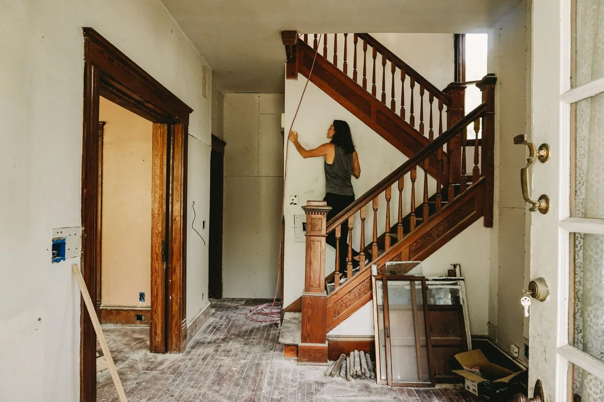 Inspecting a fixer upper's interior before selling a house in poor condition