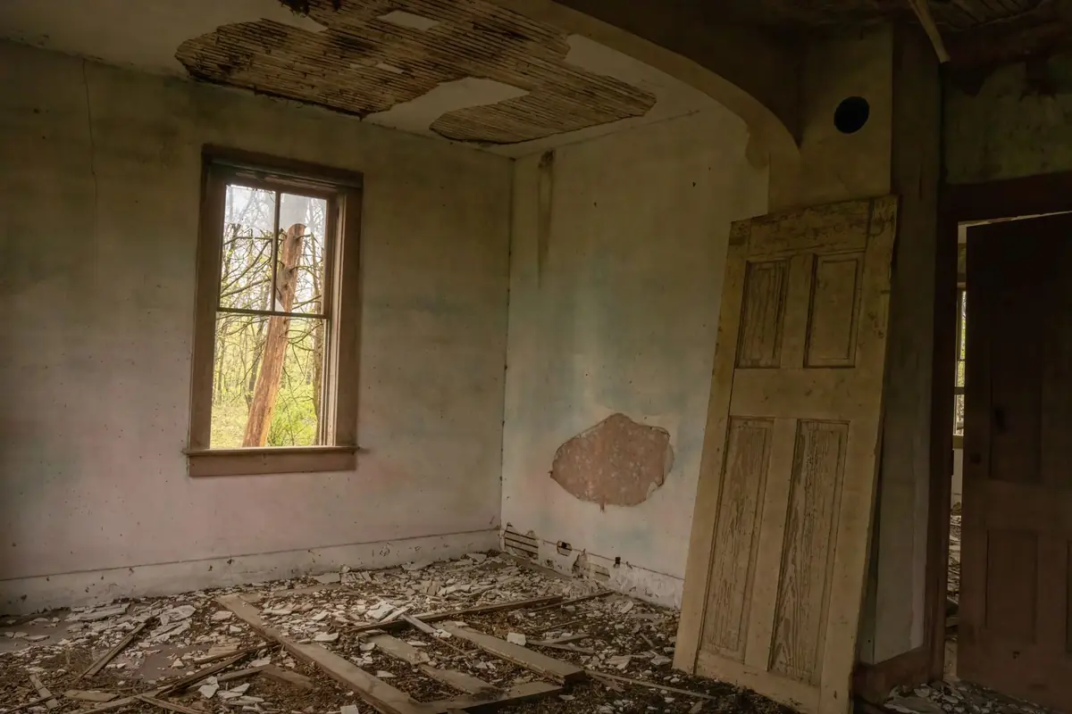 The interior of a destroyed, abandoned house a cash buyer would still purchase as-is